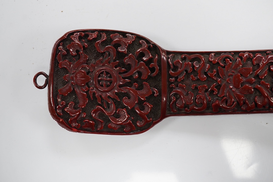 A Chinese red lacquered Ruyi sceptre, 41cm. Condition - fair to good